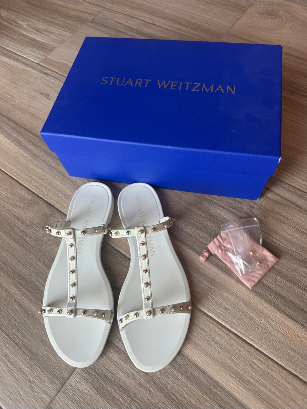 Stuart Weitzman White T-Strap Sandals with Gold Studs